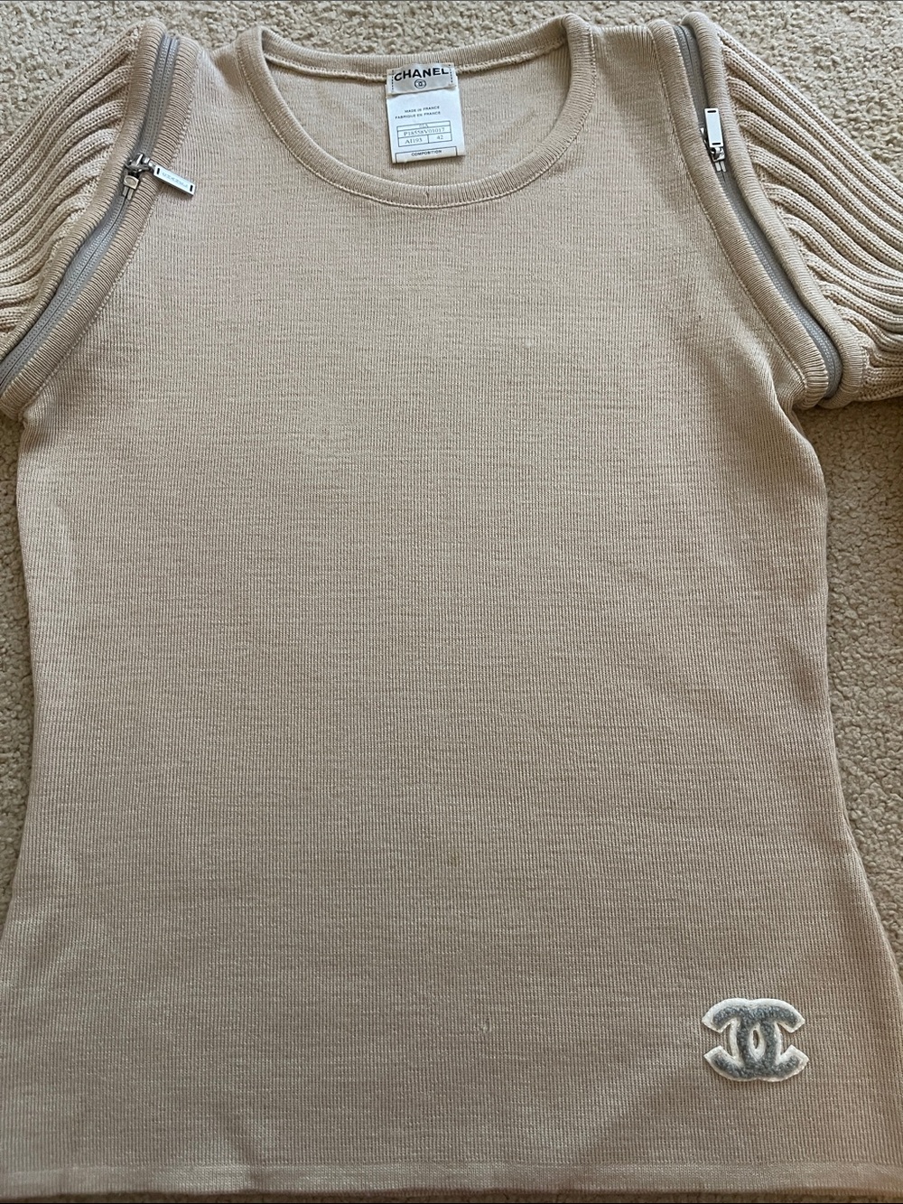 CHANEL beige knit top with CC emblem and zip-detail sleeves circa 1993
